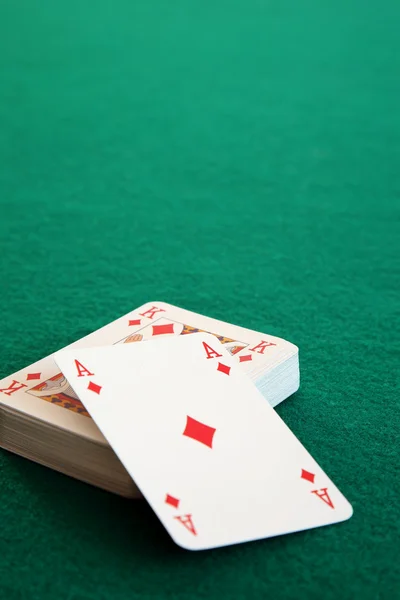 Ace of diamonds on a stack of playing cards. — Stock Photo, Image