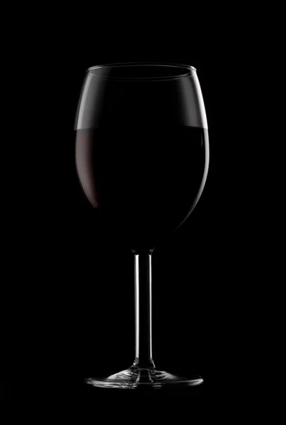 One glassed of red wine isolated on black background — Stock Photo, Image