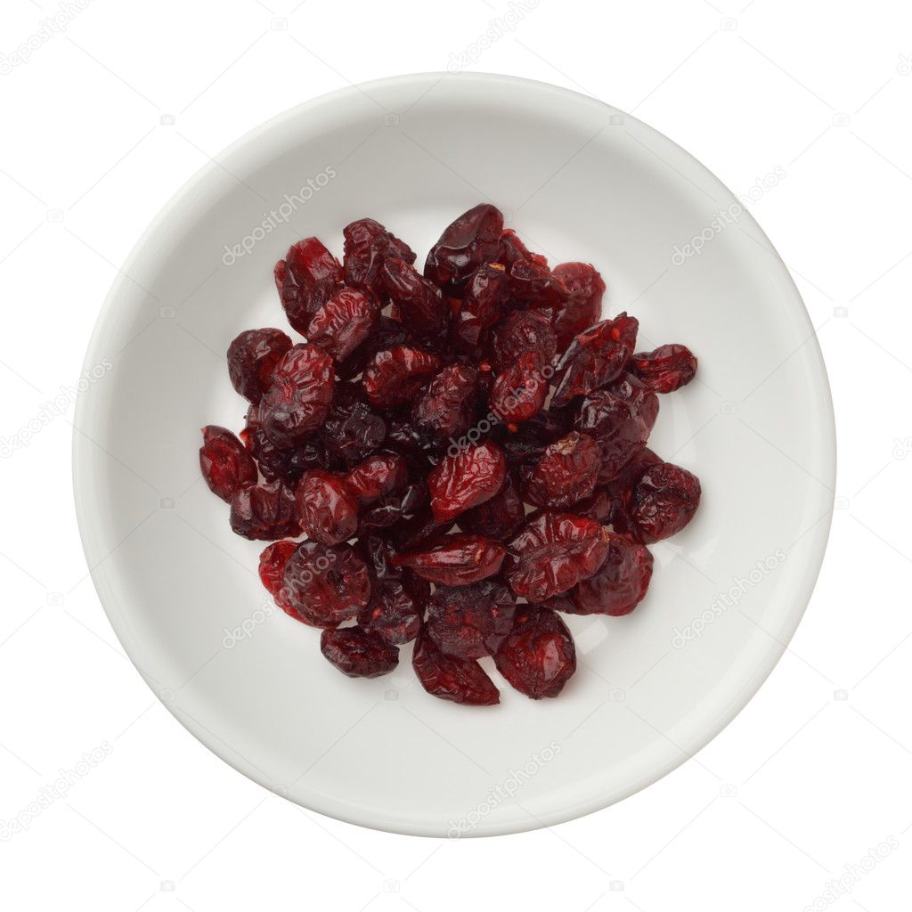 Dried cranberries in a bowl isolated on white background