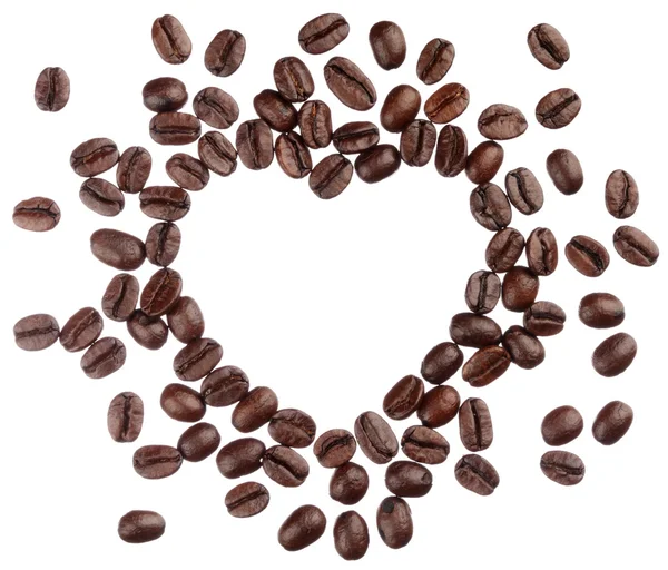 Kávová zrna srdce izolovaných na bílém pozadí zblízka — Stock fotografie