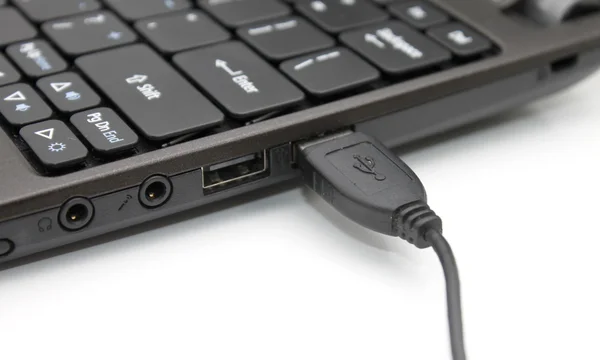 USB cable plugged in to laptop — Stock Photo, Image