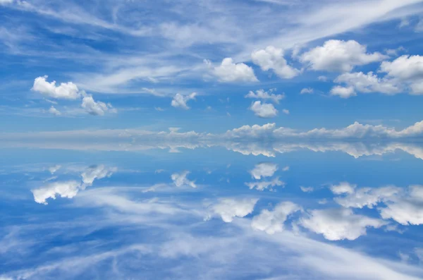 Reflection of beautiful blue sky with clouds — Stock Photo, Image