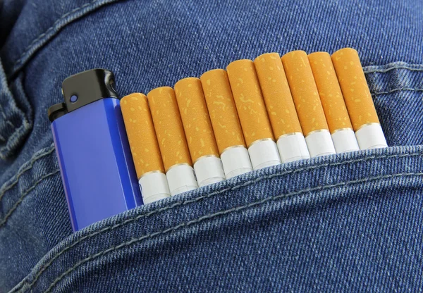 cigarette and lighter in blue jeans pocket