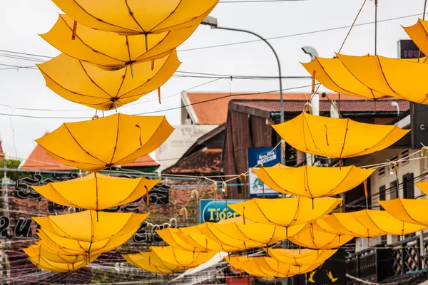 Street decorated with yellow umbrellas — Stock Photo, Image