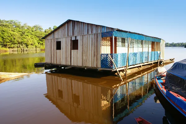 Houses on stilts rise above the polluted water in Islandia Peru — Stock Photo, Image