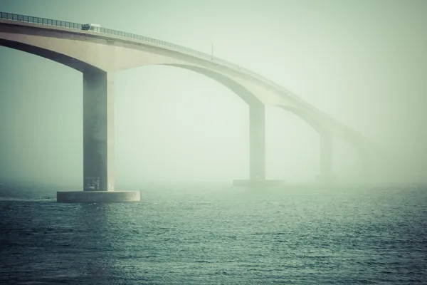 Long modern bridge over fjord — Stock Photo, Image
