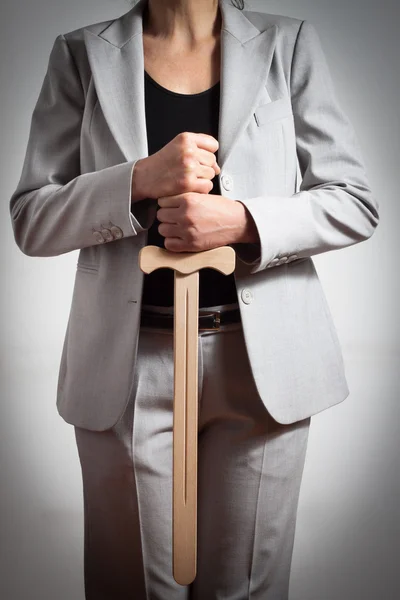 Woman with wooden sword — Stock Photo, Image