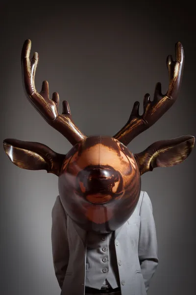 Woman with an inflatable deer head — Stock Photo, Image