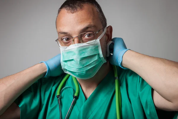 Portrait of a young physician with surgical mask — Stock Photo, Image