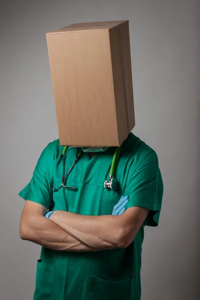 Doctor with cardboard box head — Stock Photo, Image