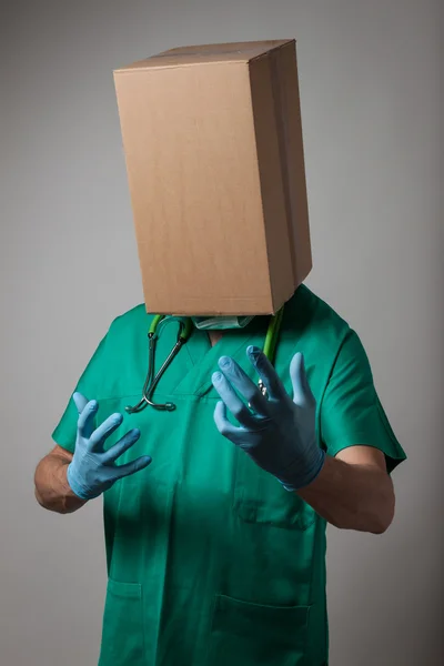 Doctor with cardboard box head — Stock Photo, Image