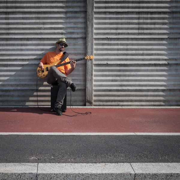 Young musician playing bass guitar — Stock Photo, Image