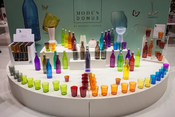 Colorful glasses and bottles on display at HOMI, home international show in Milan, Italy — Stock Photo, Image