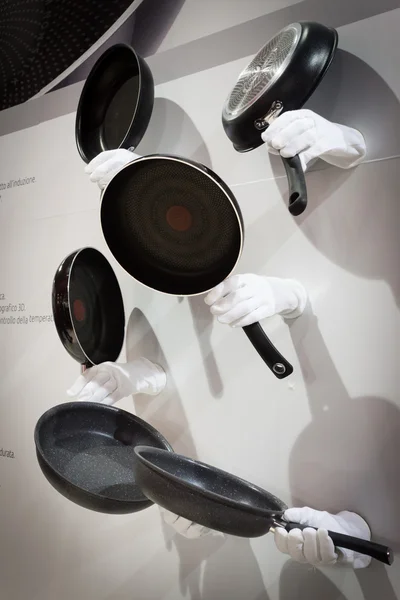 Hands holding Lagostina pans at HOMI, home international show in Milan, Italy — Stock Photo, Image