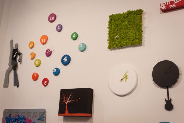 Modern clocks on display at HOMI, home international show in Milan, Italy clipart