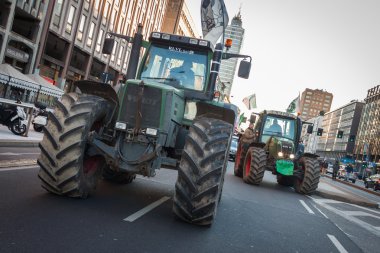 Demonstrators on tractors protesting against the government in Milan, Italy clipart