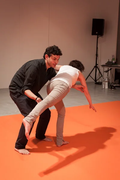 People taking a class of body awareness at Olis Festival in Milan, Italy