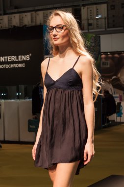 Pretty girl modelling with glasses at Mido 2014 in Milan, Italy clipart