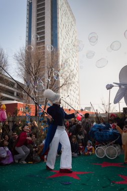 Artist with her giant soap bubbles at Milan Clown Festival clipart