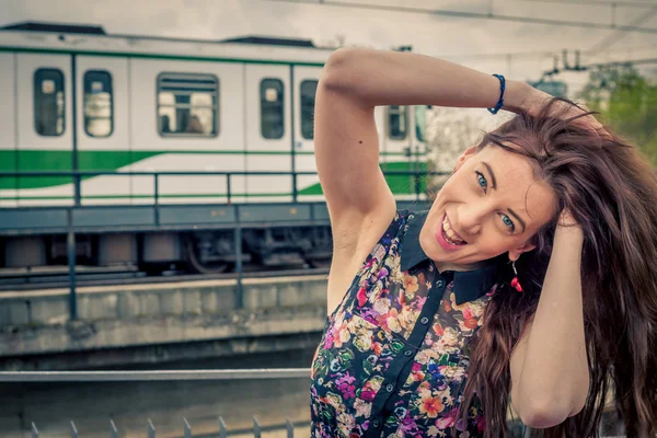 Pretty girl posing on railroad bridge — Stock Photo, Image