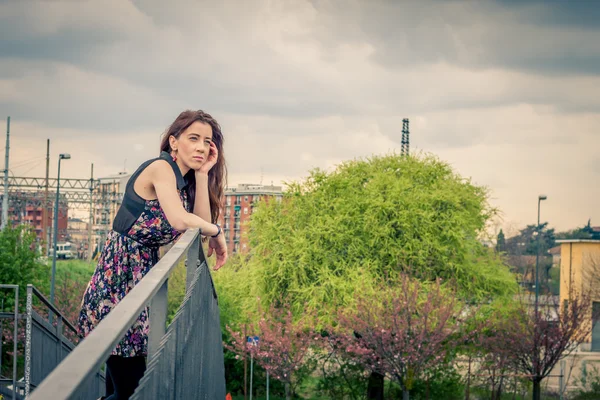 Pretty girl posing on railroad bridge — Stock Photo, Image