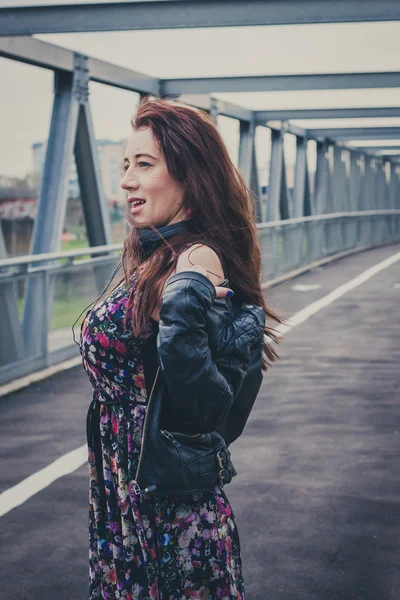 Pretty girl posing on a bridge — Stock Photo, Image