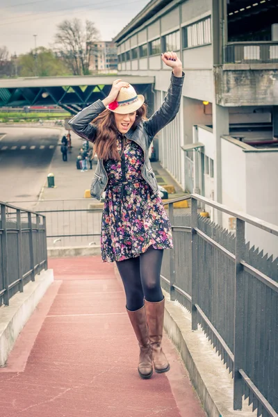 Pretty girl walking happy on railroad bridge — Stock Photo, Image