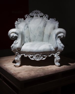 Mendini's marble armchair at Ventura Lambrate space during Milan Design week clipart