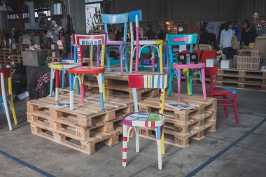 Colorful chairs at Ventura Lambrate space during Milan Design week clipart