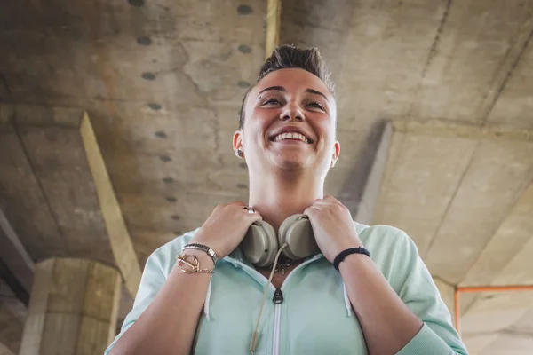 Portrait of a pretty short hair girl with headphones — Stock Photo, Image