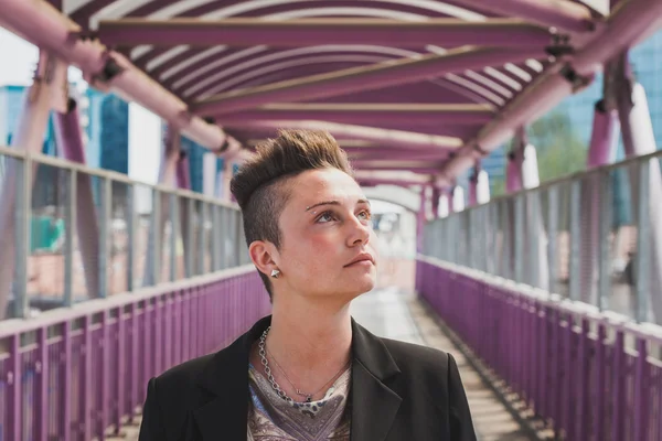 Pretty short hair girl posing on a bridge — Stock Photo, Image