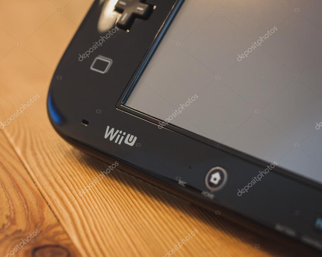 MILAN, ITALY - JULY 3, 2014: Close up of black Nintendo Wii U gamepad device. Nintendo is the world's largest video game company by revenue.