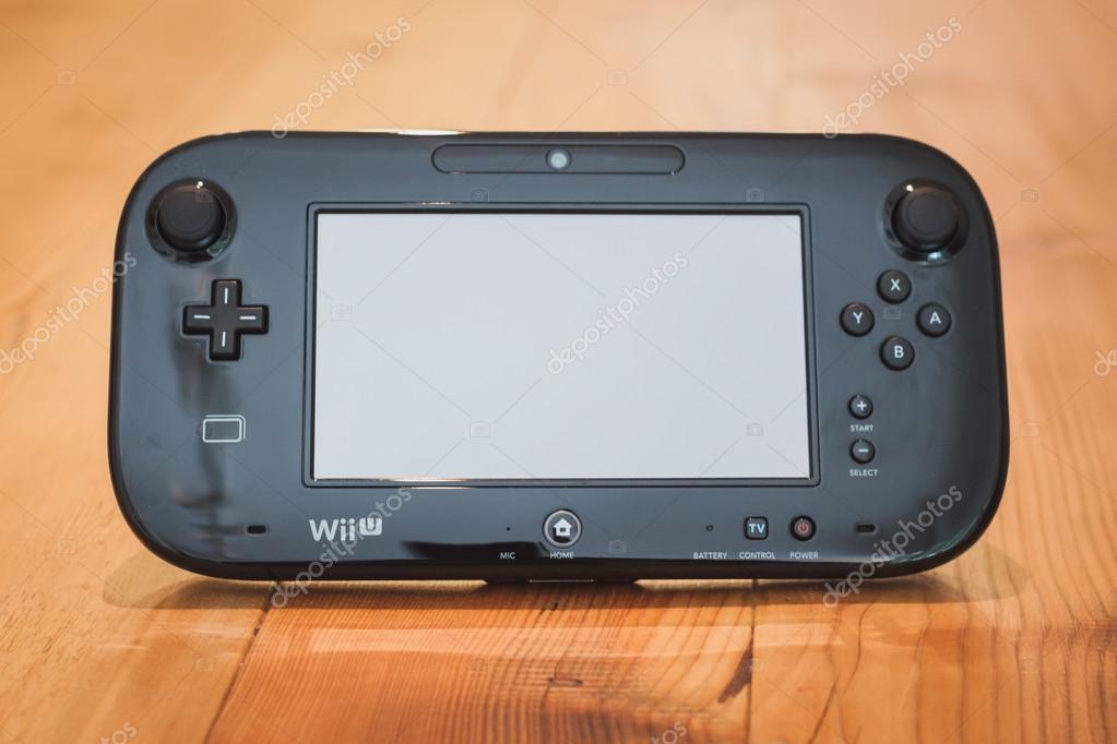 MILAN, ITALY - JULY 3, 2014: Close up of black Nintendo Wii U gamepad device. Nintendo is the world's largest video game company by revenue.