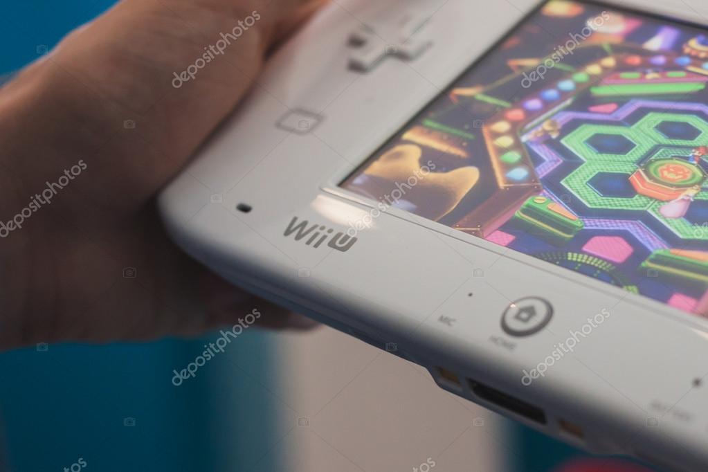 MILAN, ITALY - JULY 3, 2014: Close up of white Nintendo Wii U gamepad device. Nintendo is the world's largest video game company by revenue.