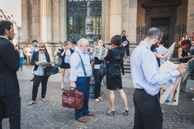 Business people take part in a flash mob in Milan, Italy clipart