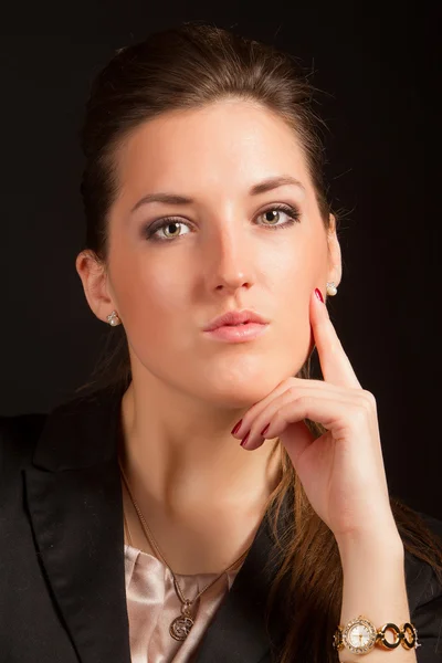 Portrait of beautiful woman posing in studio in jacket Royalty Free Stock Photos