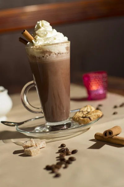 Image of hot coffe with white cream on table — Stock Photo, Image