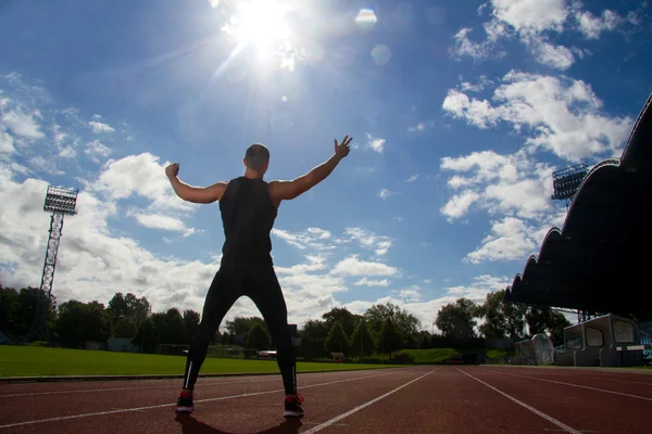 Image of muscle man posing on stadium — Stock Photo, Image