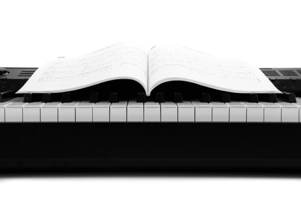 Piano keys and musical book — Stock Photo, Image