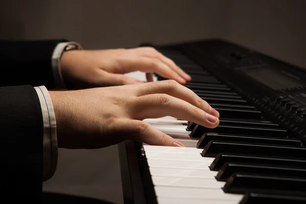 Piano keys and human hands — Stock Photo, Image