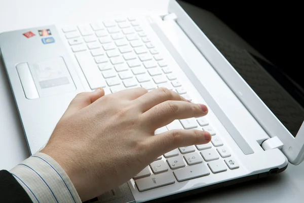 Human hand on the keyboard Stock Photo