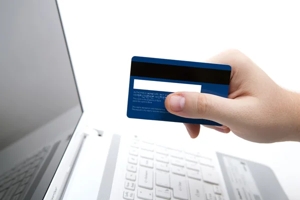 Credit card in hand when you pay Royalty Free Stock Photos