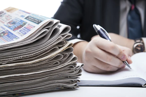 Stack of newspapers in office close-up — Stock Photo, Image