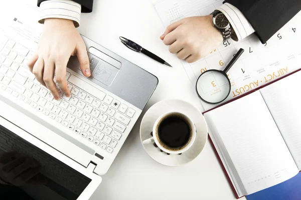 Man and cup of coffee in the workplace Royalty Free Stock Images