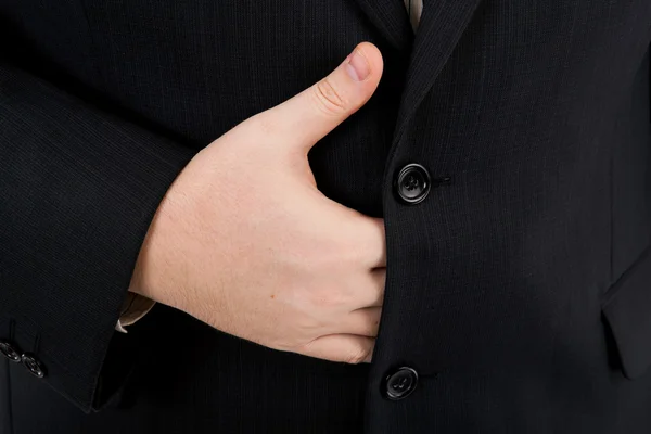 Palm of his hand under his jacket — Stock Photo, Image