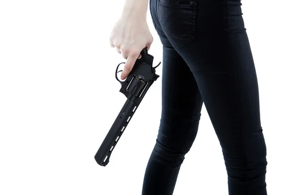 Main de fille tenant un pistolet — Photo