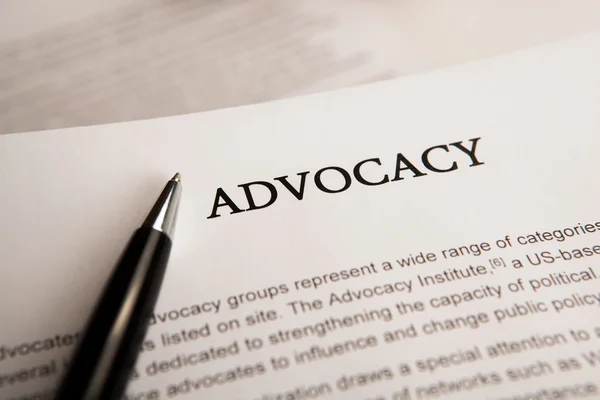 Document with the title of advocacy — Stock Photo, Image