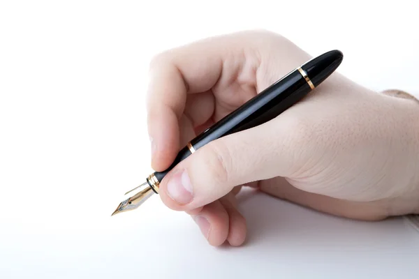 Penna i mannens hand och signatur — Stockfoto