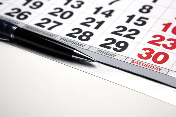 Wall calendar with pen closeup — Stock Photo, Image