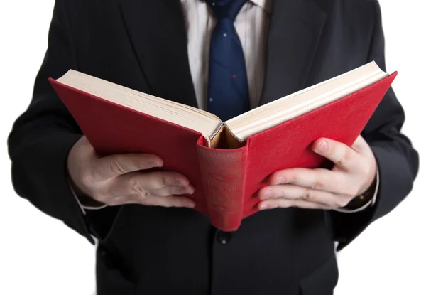 Hombre sosteniendo un libro rojo abierto —  Fotos de Stock